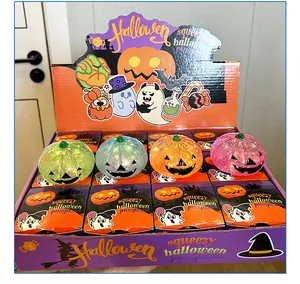 Detailansicht farbenfroher Glitzer-Halloween-Kürbis-Squeeze-Spielzeuge in Box