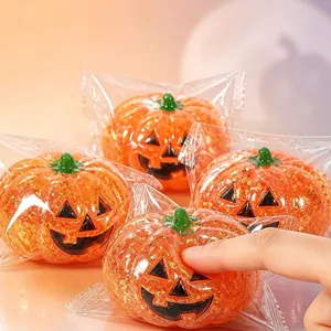 Close-up of slow rebound Halloween pumpkin squishy toy with glitter filling