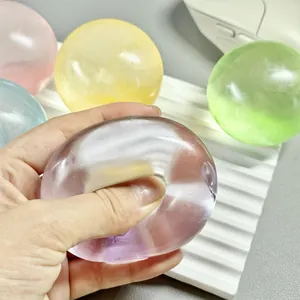 Detail showing the soft, translucent texture of a squishy stress relief ball being squeezed