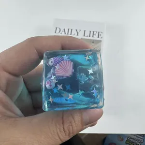 Ocean themed water cube squishy toy with colorful shells and stars for stress relief