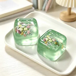 Macro detail of green maltose ice cube squishy toys with ocean shell glitters inside