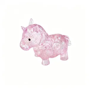 Detailed view of translucent pink unicorn squeeze toy with sparkling glitter inserts