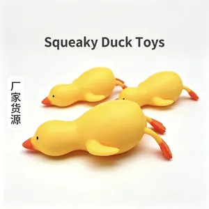 Close-up macro view of three yellow duck slow rebound squishy toys for stress relief