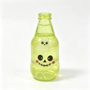 Juguete squishy de Halloween en forma de botella verde con cara de fantasma y calavera