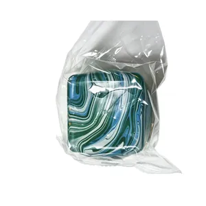 Square marble pattern squishy stress relief toy in a clear protective plastic bag