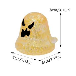 Detail view showing 8cm/3.15in dimensions of the yellow glittery Halloween ghost squeeze toy.