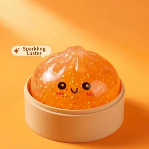 Dettaglio del giocattolo antistress a forma di panino arancione con glitter e sorriso
