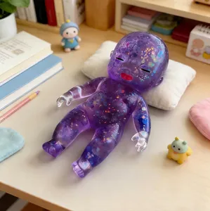 Close-up of a galaxy-patterned purple stress relief doll lying on a white pillow.