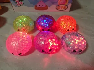 Detailed macro view of colorful LED light-up squishy bun toys with glitter filling