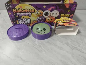 Close-up of Halloween glitter squishy toy in steamed bun shape with purple basket