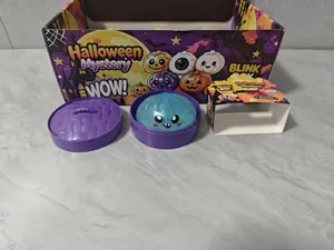 Halloween mystery box glitter squishy toy with purple steamer container detail view