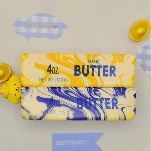Two 14cm butter stick squishy stress relief toys in yellow and blue marble patterns