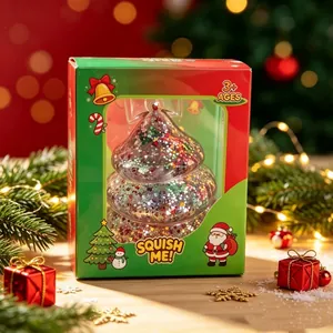 Detail view of a Christmas tree squishy toy with glitter inside its festive packaging.
