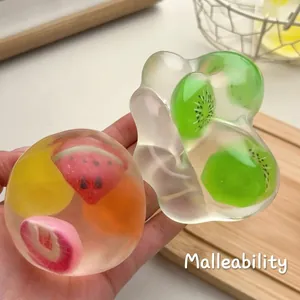 Balle anti-stress spongieuse aux fruits transparente pour le soulagement de l'anxiété
