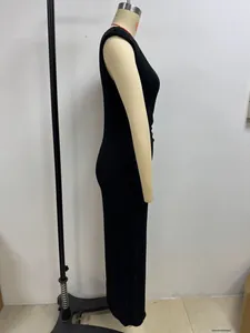 Detailed side view of a black sleeveless water wave texture maxi dress on a mannequin