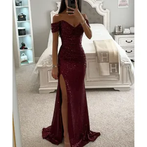 Elegant burgundy off-the-shoulder sequined evening gown with a high leg slit.