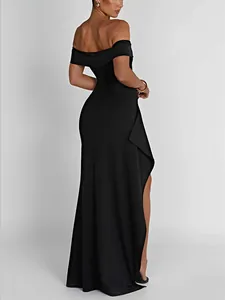 Side view of elegant black off-the-shoulder evening dress with a high side slit