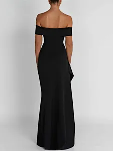 Back view detail of elegant black off-the-shoulder evening gown with sleek tailoring