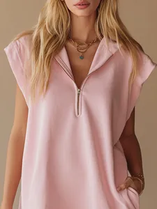 Detail shot of pink sleeveless mini dress with v-neck and front zipper for summer