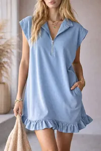 Close-up of blue sleeveless ruffled A-line dress with zipper V-neck and side pockets