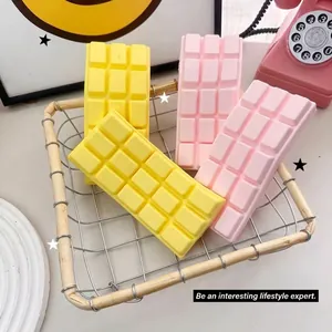 Yellow and pink chocolate-shaped slow rebound squishy toys in a basket