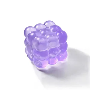 Close-up showing the translucent texture of a purple bubble cube stress relief toy