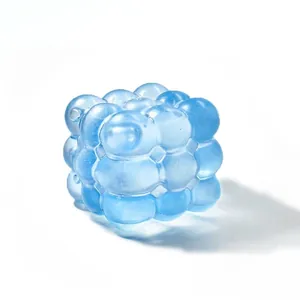 Detailed view of a translucent blue bubble cube sensory squishy stress relief toy.