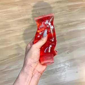Red translucent star patterned toothpaste-shaped squishy toy for daily stress relief