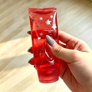 Red translucent star squeeze toy for stress relief and sensory play in a toothpaste tube