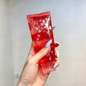 Red translucent squeeze toy filled with silver stars and gel for stress relief