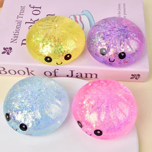 Set di quattro squishy baozi glitterati colorati con faccine carine per lo stress