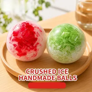 Translucent red and green crushed ice textured decompression balls on a wooden tray.