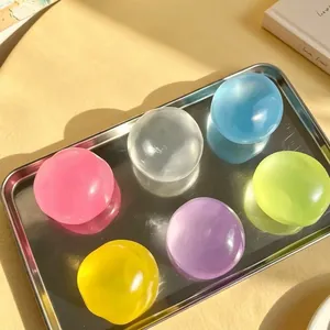 Macro view of colorful jelly-like stress relief squishy toys in a metal tray