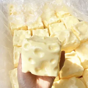 Close-up detail of realistic yellow cheese-shaped squishy toy for stress relief and fun