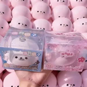 Macro view of two boxed seal squishy stress relief toys showing cute packaging details.