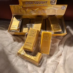Close-up of simulation gold bar squishy toys with realistic 999.9 fine gold texture