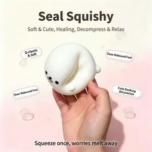 Close-up of white seal squishy toy being squeezed for slow rebound stress relief