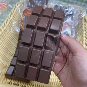 Close-up detail of a dark chocolate bar squishy toy showing its slow rebound texture
