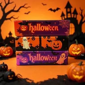 Close-up of three stacked Halloween slow-rebound squishy toys with pumpkin designs