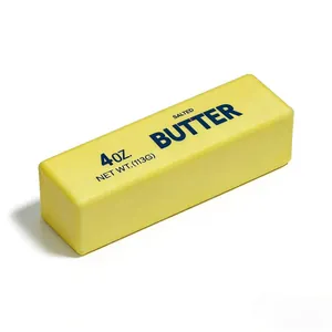 Detailed view of the yellow simulation butter stick squishy toy with realistic printing