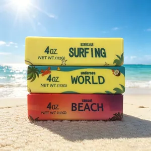 Colorful butter stick slow rebound squishy toys stacked on a sunny beach sand.