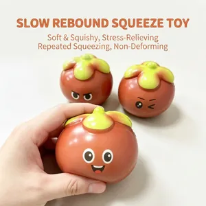 Close-up of hand squeezing a slow-rebound mangosteen squishy stress relief toy.
