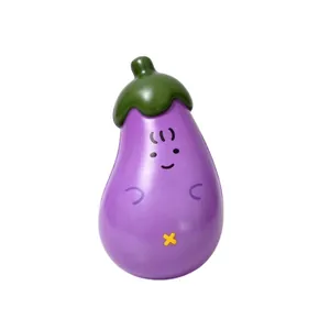 Close-up of a cute eggplant squishy toy with a smiling face and soft texture
