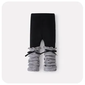 Legging confortable pour bébé noir et gris avec petits nœuds et bordures à volants