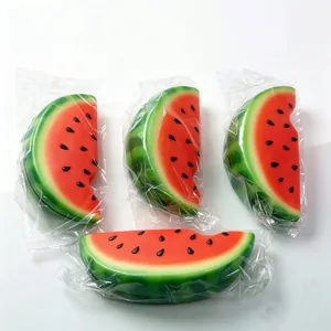 Detail view of individually wrapped realistic watermelon slice squishy stress relief toys