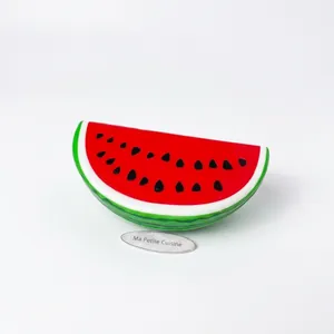 Realistic slow rebound PU foam watermelon slice squishy toy for stress relief therapy.
