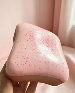 Close-up of pink strawberry jam texture on a soft butter toast squishy stress relief toy
