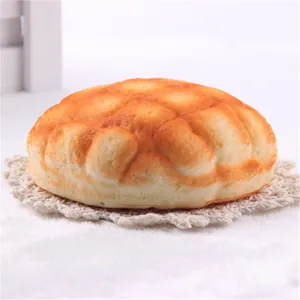 Detailed view of the realistic texture on a PU slow-rebound pineapple bun squishy toy.