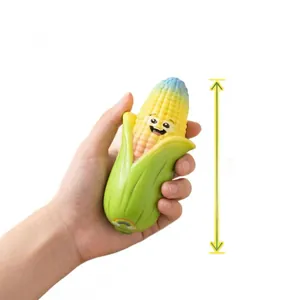 Cute smiling corn PU slow rebound squishy toy held in hand for size demonstration