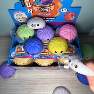 Set of colorful baozi squishy fidget toys with one being squeezed to show bubble feature